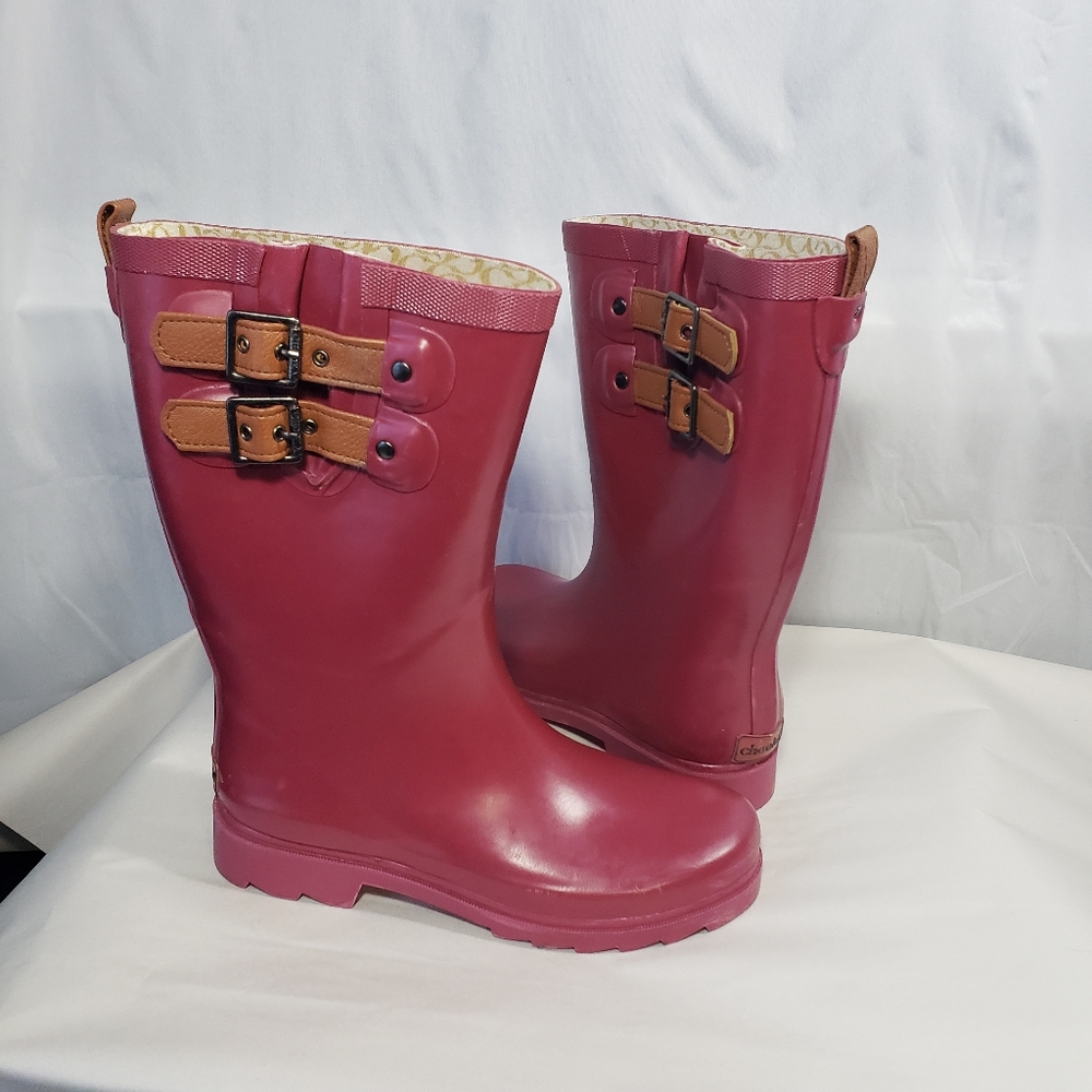 Chooka raspberry pink rain boots with brown side buckles. Size 7